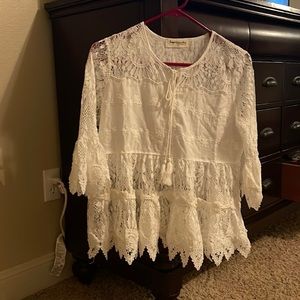 New with tags white small lace top. Never worn.